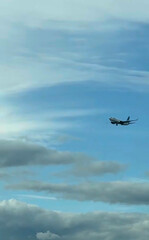 Skyward-bound airplane waltzing through vast azure canvas, evoking adventure and escape, reminiscent of Bon Festival journeys and Sky Day