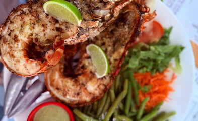 Grilled lobster with zesty lime awakens Mardi Gras revelry, embodying seafood indulgence and...