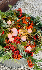 Candles nestle amidst vibrant orange rowan berries and lush foliage, ideal for Samhain rituals and...