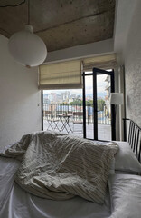 Crinkled duvet whispers tales of dreams under urban canopy, perfect for World Sleep Day or the Autumnal Equinox