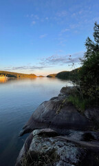 Serene Scandinavian fjord at dusk, tranquil nature retreat, midsummer dreamscape, soothing aquatic whispers, Nordic peace, Scandinavian oulujuhla