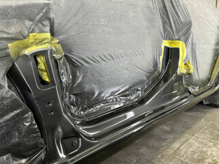 Glistening automotive panel under metallic twilight, exhibiting Zen-like patience of masterful...
