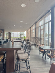 Modern Cafe Interior with Empty Tables and Chairs