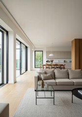 Fototapeta premium Modern open living room with large windows and neutral decor 