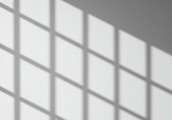Clean, aesthetic wall texture created by natural light casting a repeating grid shadow