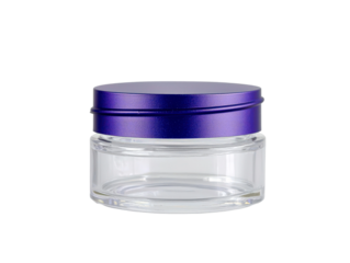 Clear glass jar with purple metal lid isolated on a white background, ideal for packaging products, cosmetics, or food items for a modern aesthetic.