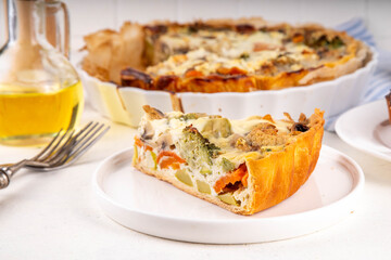 Vegan quich tart pie with various summer seasonal vegetables