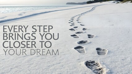 Footprints on a Sandy Beach with Motivational Quote for Inspiration