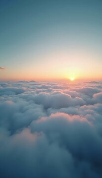 A view of the sun setting over the clouds from an airplane.