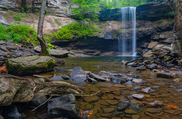 Creek flowing from Greeter Falls waterfall framed with boulders and trees, Savage Gulf State Park,...