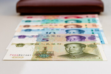 Chinese Yuan Banknotes in Ascending Order with Wallet. Finance and Savings Concept.