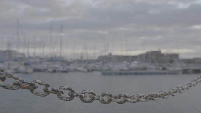 B Roll shot of a chain along a pier in Kalk Bay harbour, Cape Town.