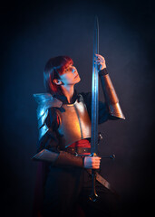 Fantasy warrior woman with red hair in historical medieval  armour costume,  cinematic studio...