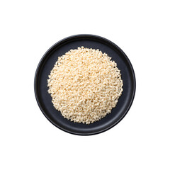 White sesame seeds served on a black plate
