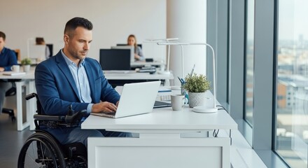 Professional businessman working on laptop in modern office embracing diversity inclusion