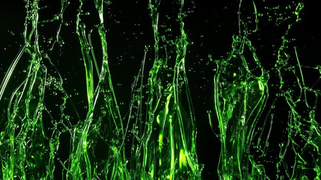 Splashing natural oil, green substance, abstract background . Super slow motion filmed on high speed cinematic camera at 1000 FPS