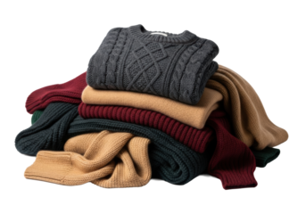 Piled luxurious chunky cashmere sweaters and soft wool scarves in charcoal, burgundy, camel, dark green on white with copy space, soft studio light, sophisticated winter luxury