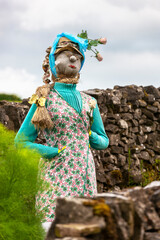A quirky, beautiful scarecrow in a garden: Chapel Lane, Tissington, Derbyshire, England