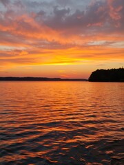 Obraz premium Stunning sunset over serene lake nature photography tranquil environment scenic viewpoint peaceful concept