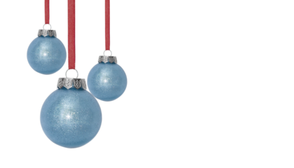 Composition from three blue Christmas and New year balls hanging on ribbon, white background