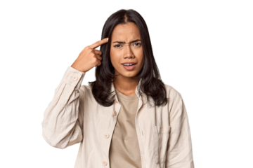 Portrait of a young Filipino woman showing a disappointment gesture with forefinger.