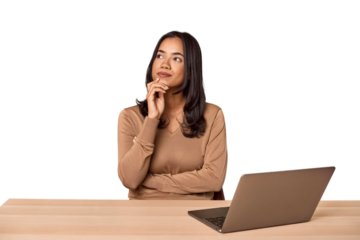 Filipino woman at desk with laptop looking sideways with doubtful and skeptical expression.