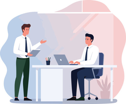 Two professional businessmen collaborating in a modern office one standing and presenting while the other works on a laptop at his desk.