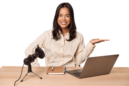 Woman records podcast with laptop showing a copy space on a palm and holding another hand on waist. - Powered by Adobe