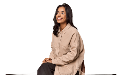 Seated Filipino woman looking at camera