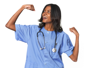 Young Indian nurse with stethoscope raising fist after a victory, winner concept.