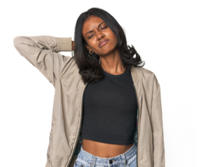 Portrait of a young Indian woman suffering neck pain due to sedentary lifestyle.