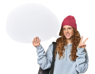 Redhead holding a comic speech bubble joyful and carefree showing a peace symbol with fingers.