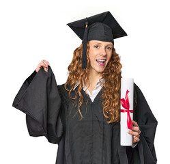 Proud redhead graduate with diploma, studio shot