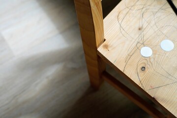 Minimalist Wooden Chair with paper on Natural Wood Surface kindergarten activity nursery kids...