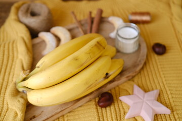 Conceptual creative bananas on wooden table, Ripe yellow bananas, rich in potassium, healthy...