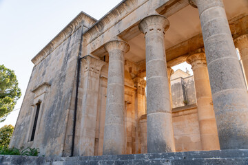 Fototapeta premium Stone columns and facade of cemetery building