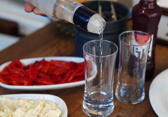Turkish raki, salad and appetizers on the table
