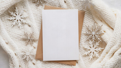 Cozy winter scene with blank card and envelope, perfect for holiday greetings, invitations, and seasonal designs