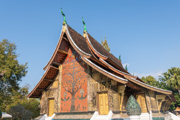 Fototapeta premium Wat Xiengthong Ancient Buddhist temple with traditional architecture in Luang Prabang Laos