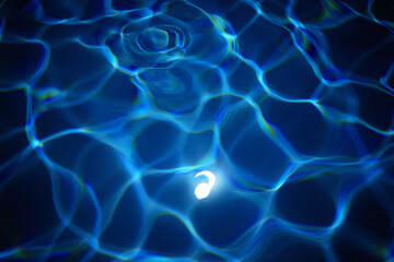 Glowing comma symbol submerged in blue water punctuation