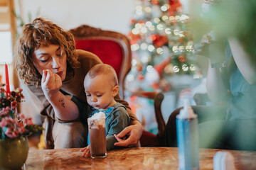 A tender interaction between a loving mother and her young child during a cozy holiday gathering,...