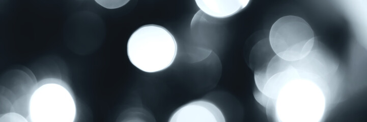Blurred lights, gray, deep blue background, banner texture. Abstract bokeh with soft light header. Wide screen wallpaper. Panoramic web banner with copy space for design