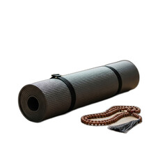 A rolled gray yoga mat with black straps and prayer beads on a dark background scene setup
