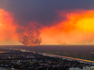 Everglades fires causing red sunset smoke sky