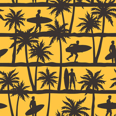 Surfers walking among palm trees at sunset