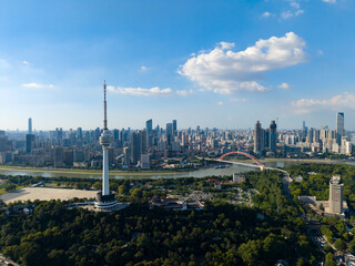 Aerial view of Wuhan China cityscape reveals modern skyscrapers and a towering structure beside the...