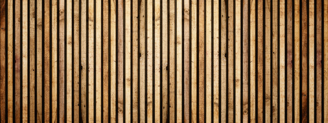 Closeup view of textured wooden slats background. Decorative brown wood paneling with vertical stripes, showing natural wood grain and texture. Wood texture background