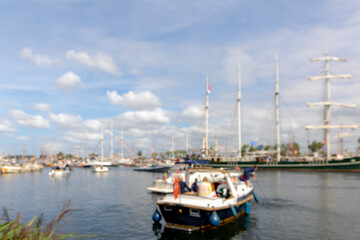 Abstract blurred background, Out of focus sail boat parade in the north sea canal (Noordzeekanaal) SAIL is a maritime event held once every five years in Amsterdam, Tall ships from all over the world.