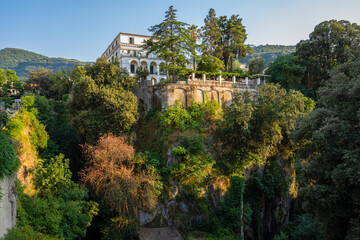Obraz premium Italian Villa, Lush Greenery, Blue Sky.
