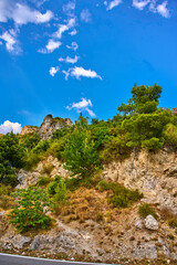Rocky Hillside, Trees, Blue Sky, Clouds
